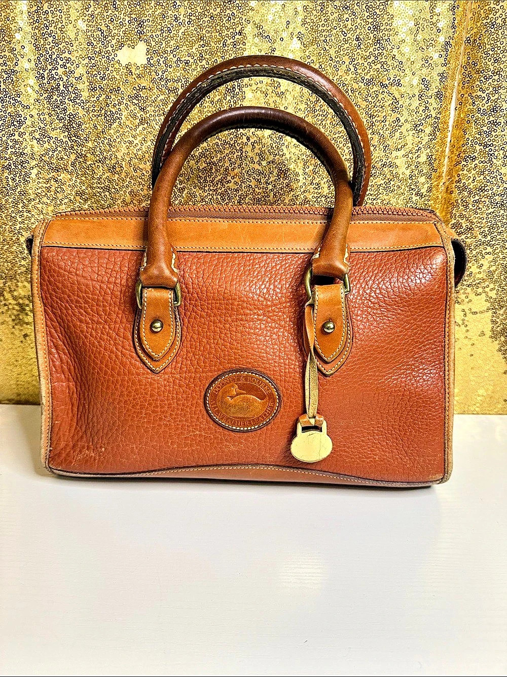 Vintage Dooney & Bourke All weather Leather Satchel in tan color